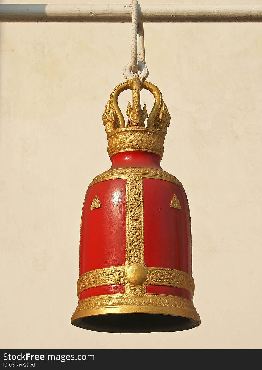 Decorative of red ancient bell with gold in sunny day