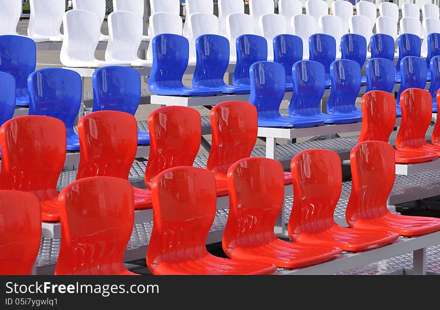 Stock Photo - bright chairs at the stadium. Stock Photo - bright chairs at the stadium.