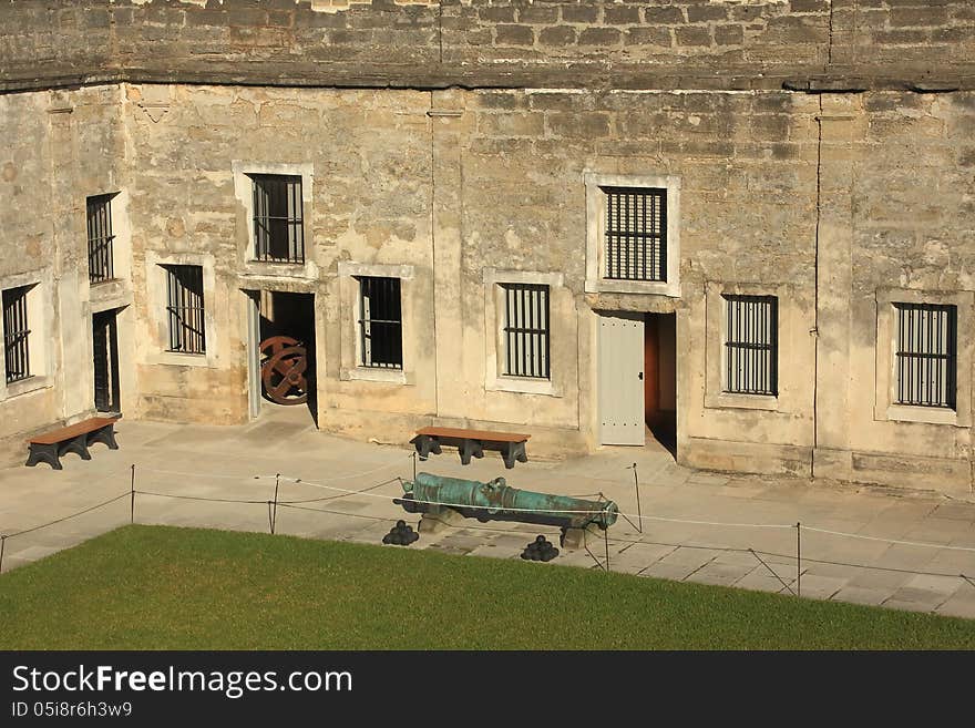 Castillio San Marcos in St. Augustine, Florida, interior fortress walls with grass and cannon. Castillio San Marcos in St. Augustine, Florida, interior fortress walls with grass and cannon