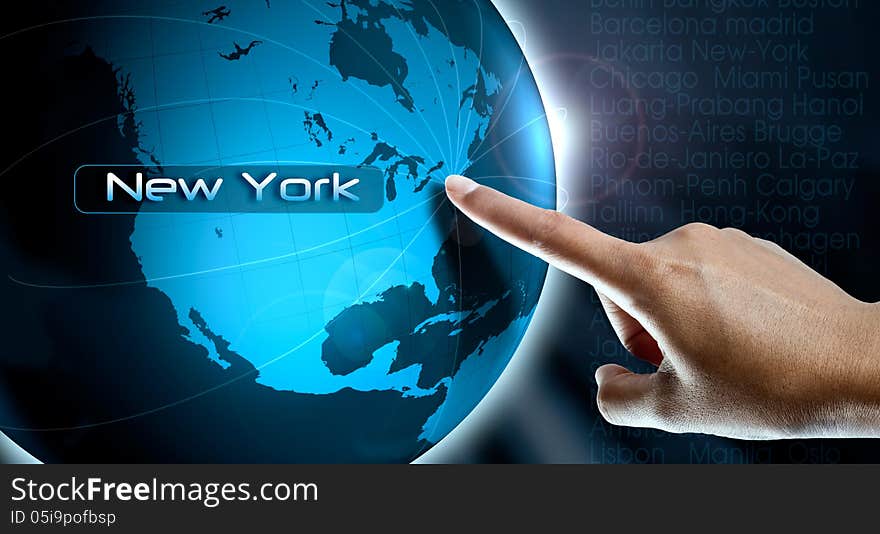 A woman finger point New York city on the world map. A woman finger point New York city on the world map