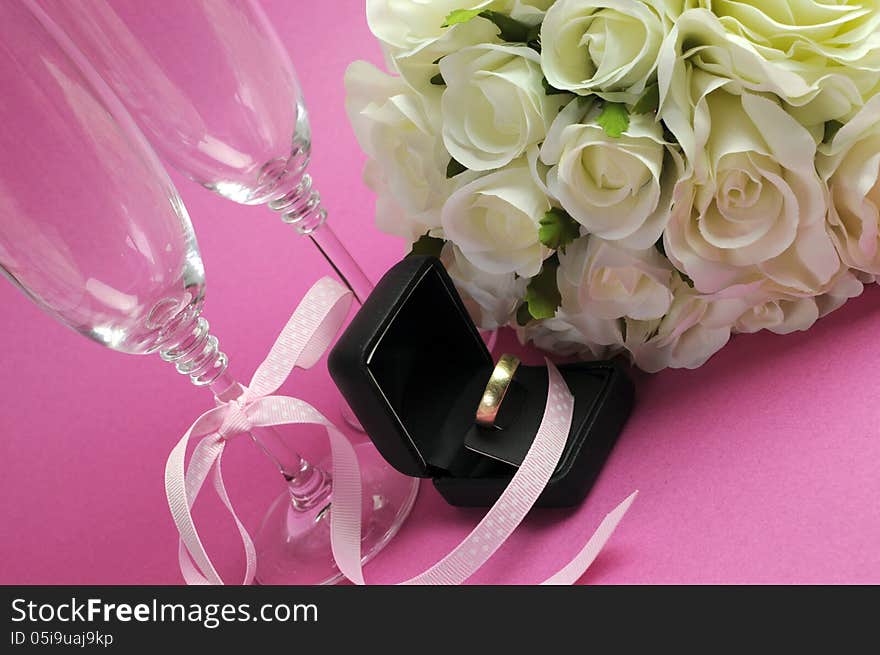 Wedding bridal bouquet of white roses on pink background