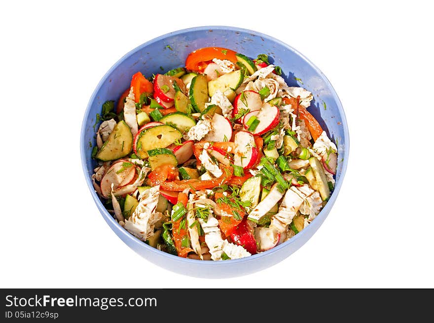 Salad from cucumbers, tomatoes and radish in the plastic plate isolated on white background