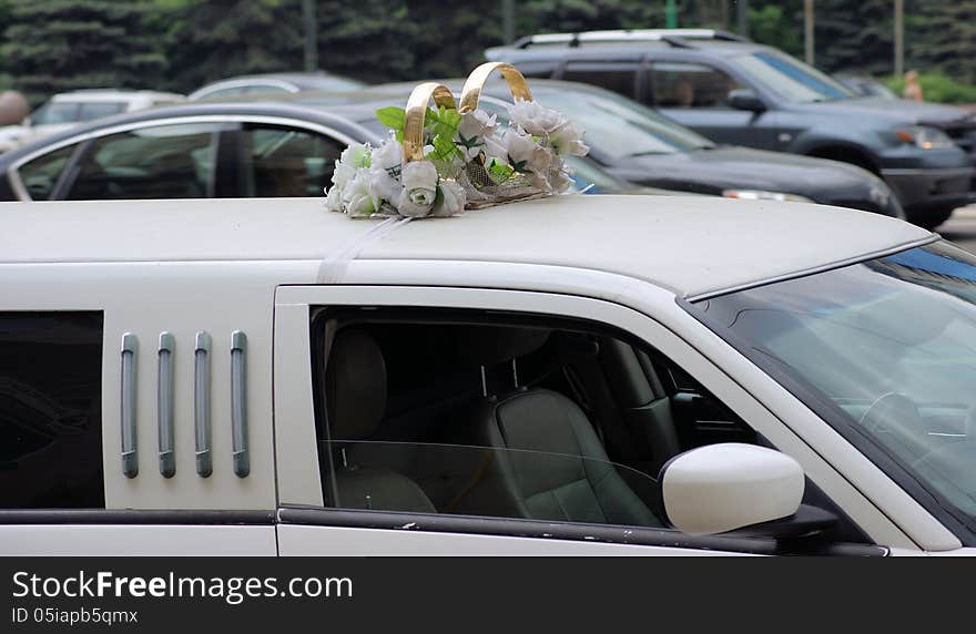 Gold rings on wedding limousine