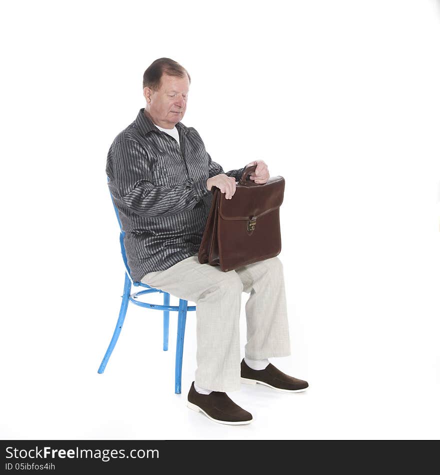 A very active grandfather, retired posing for a photograph