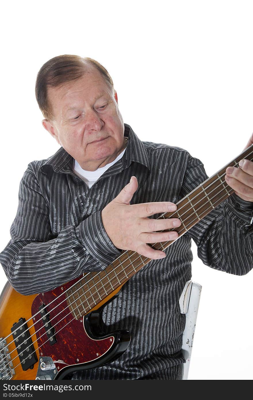 A very active grandfather, retired posing for a photograph