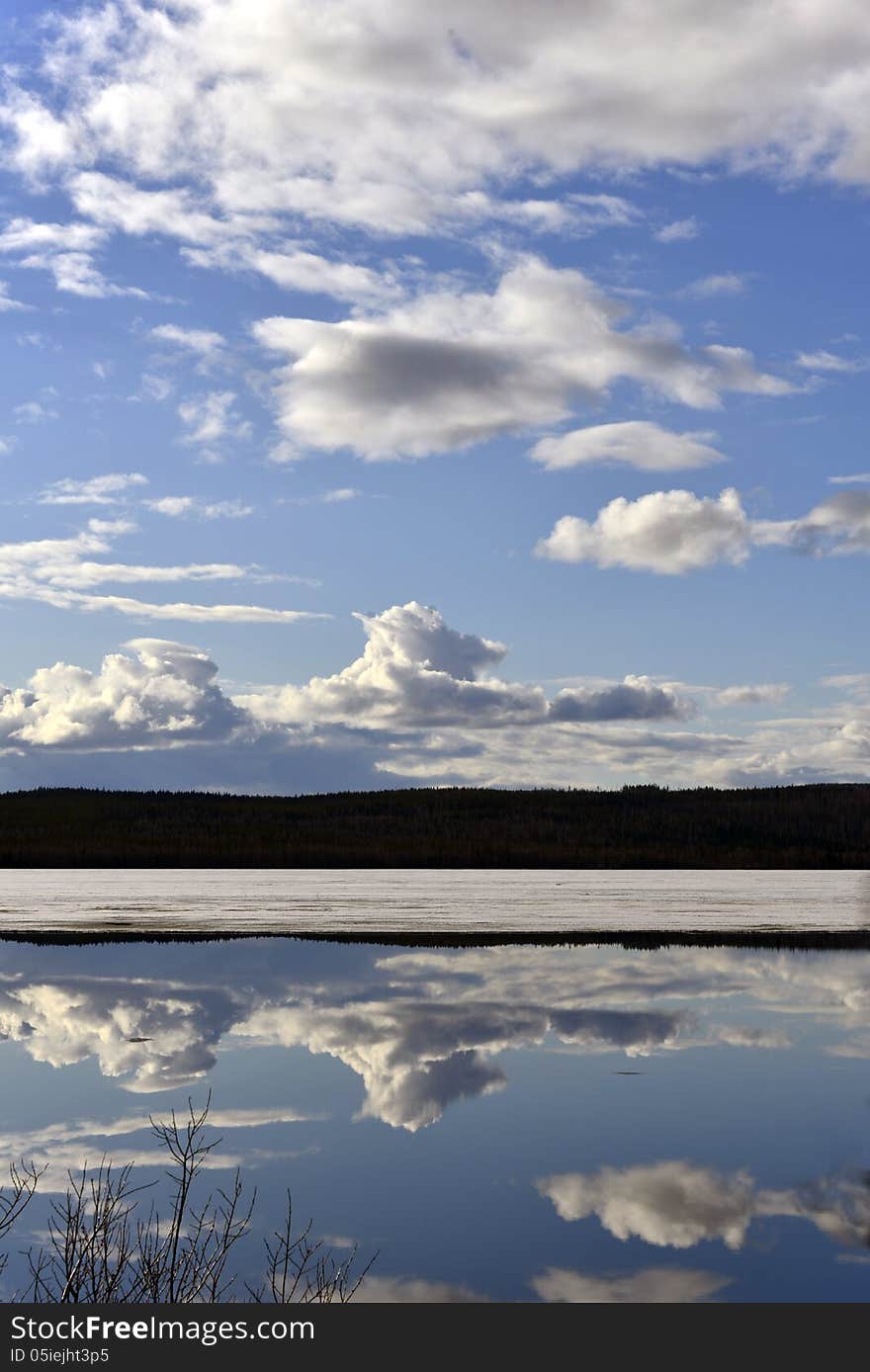 Mirror blank lake against beautiful sky. Mirror blank lake against beautiful sky