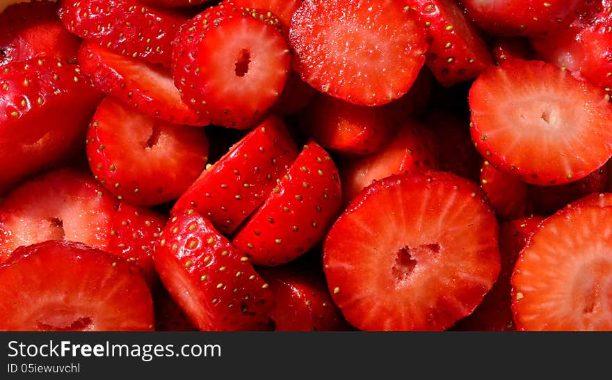 Background, macro shot of chopped strawberries, horizontal orientation