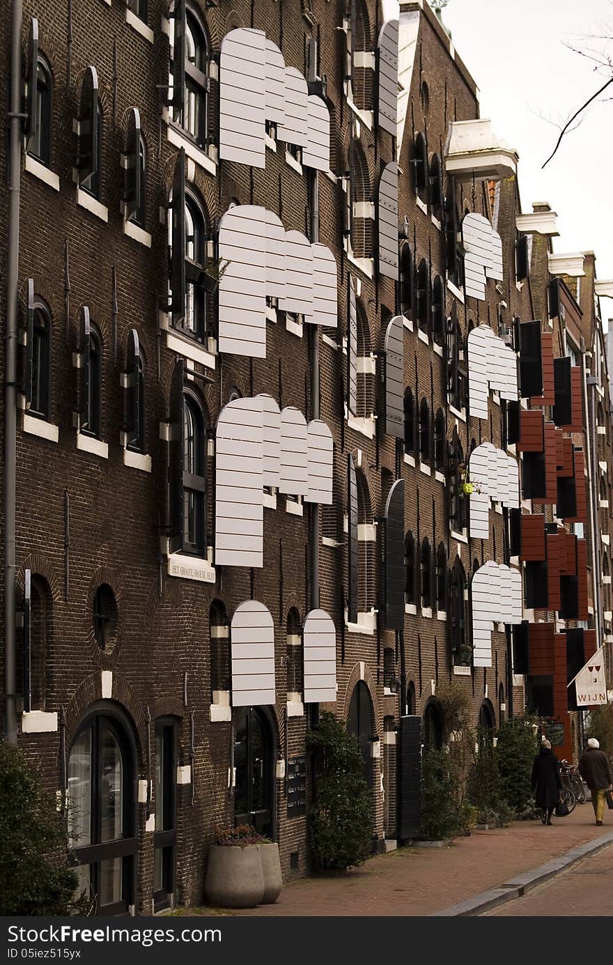 A building with beautiful windows in Amsterdam, Netherlands. A building with beautiful windows in Amsterdam, Netherlands