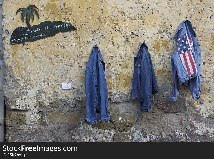 Second-hand clothes sold in the main square of medieval village of Calcata, Rome by hippy community. Second-hand clothes sold in the main square of medieval village of Calcata, Rome by hippy community.