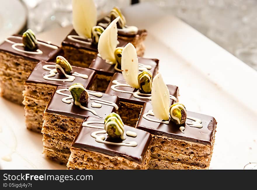 Slices of chocolate cakes on a white plate