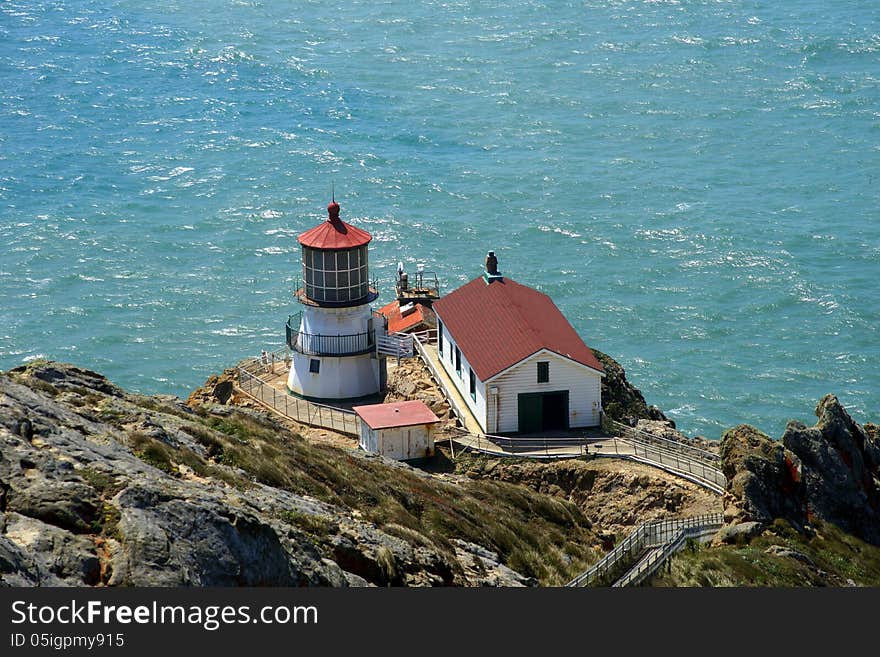 The light house of Point Reyes at the Northern California Shoreline .