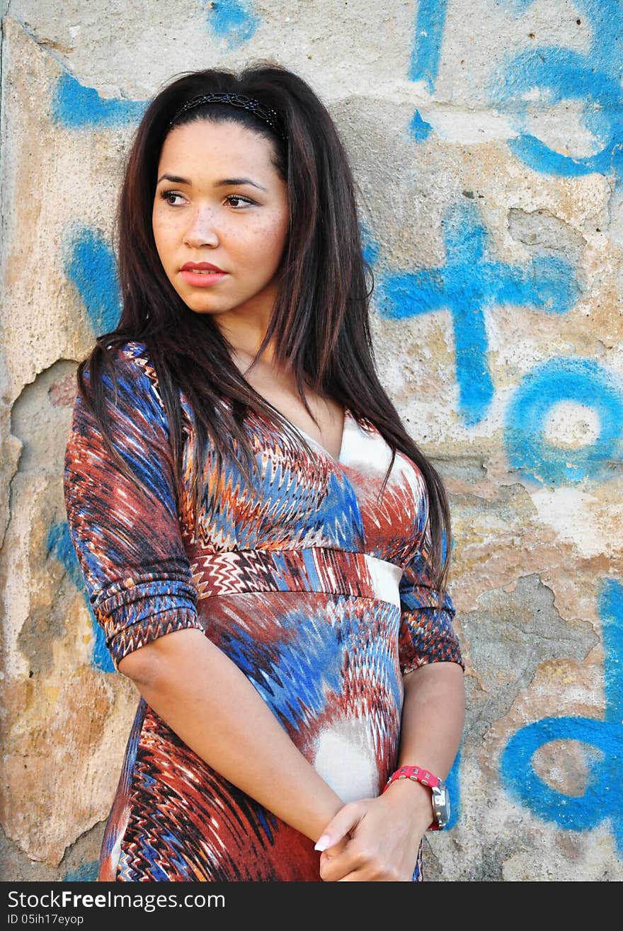 Outdoor portrait of an attractive young woman with long black hair . Outdoor portrait of an attractive young woman with long black hair .