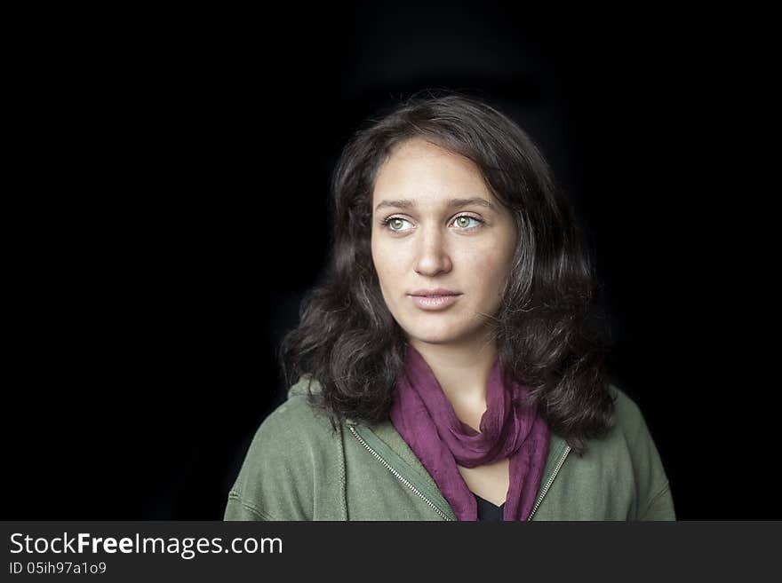 Portrait of a beautiful young woman with striking green eyes. Portrait of a beautiful young woman with striking green eyes.