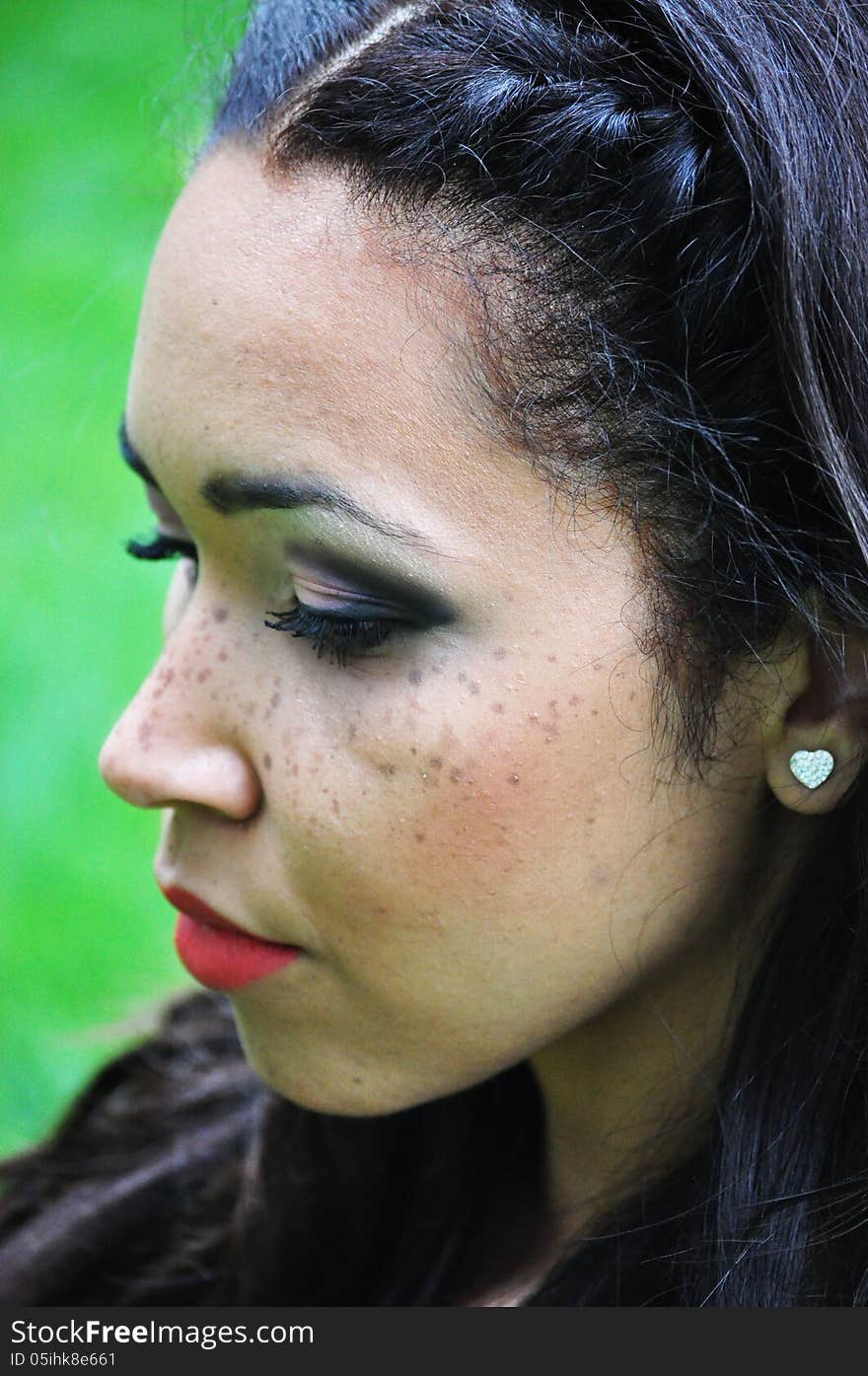 Close-up portrait of an attractive young woman with long black hair . Close-up portrait of an attractive young woman with long black hair .