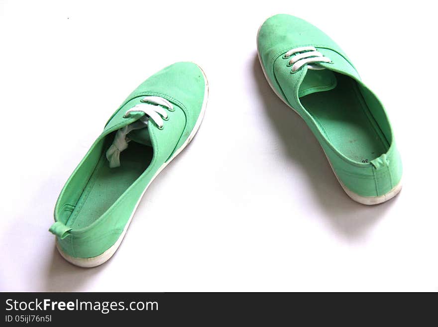 Dirty Green shoes in white background. Dirty Green shoes in white background