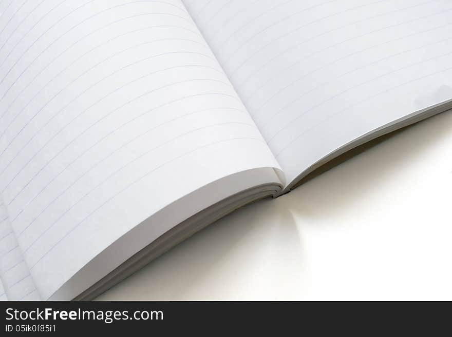 Opened blank notebook with sheets in lines