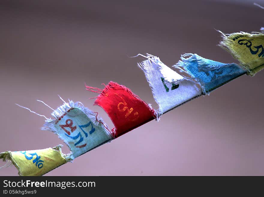 Buddhist prayer flags flying with wind