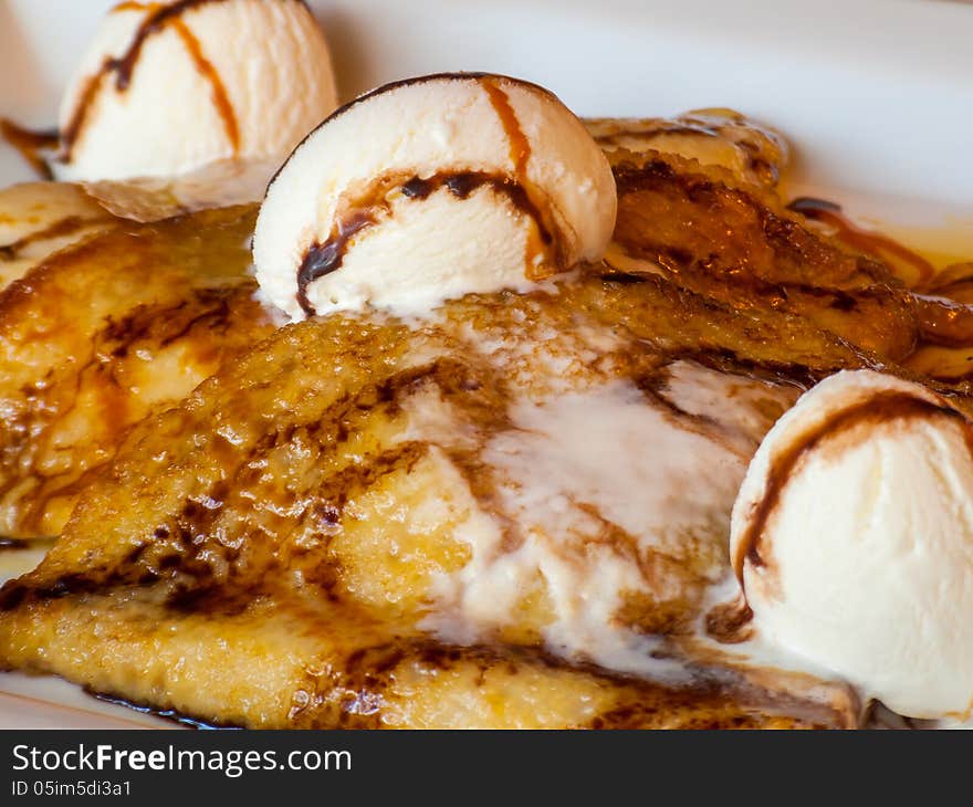 National classic French sweet pancakes with creamy cool ice cream, covered with natural alpine honey and hand made ​caramel. National classic French sweet pancakes with creamy cool ice cream, covered with natural alpine honey and hand made ​caramel