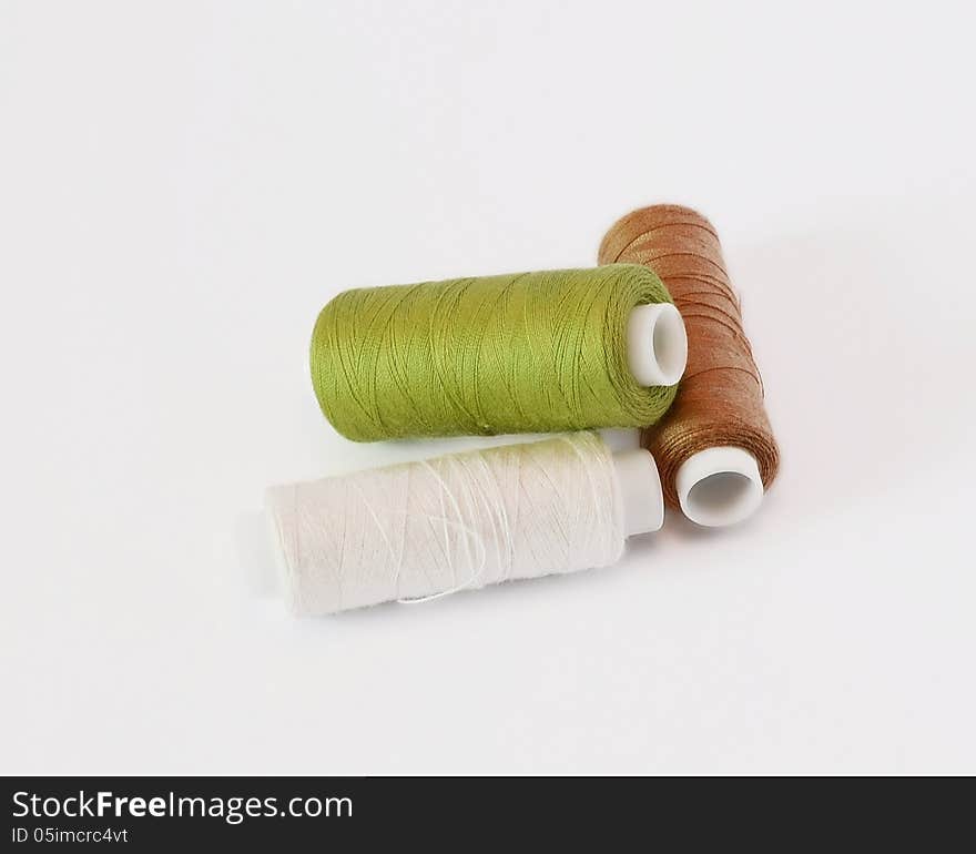 Three spools of thread