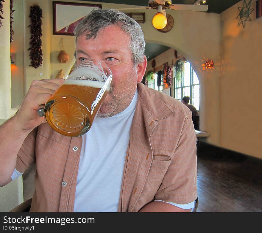 Man drinking beer at a restaurant