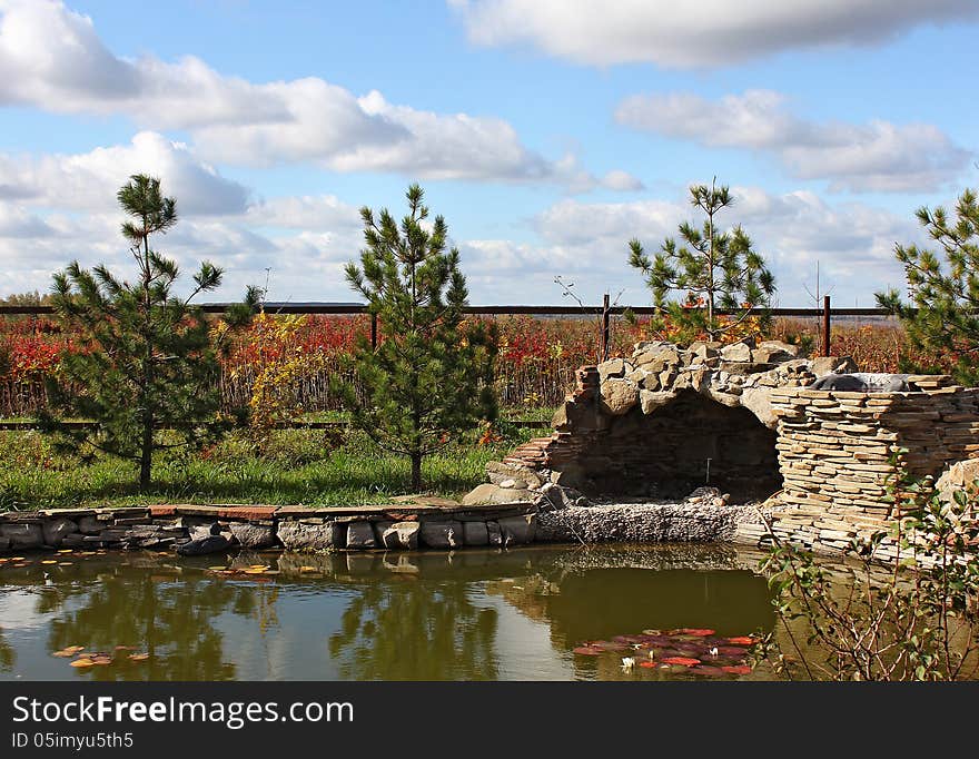 Garden with a pond and a grotto, autumn, Russia