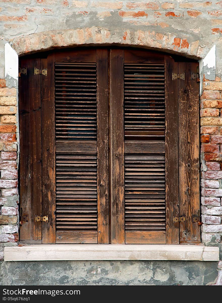 Old wooden window with old wall in Italy. Old wooden window with old wall in Italy