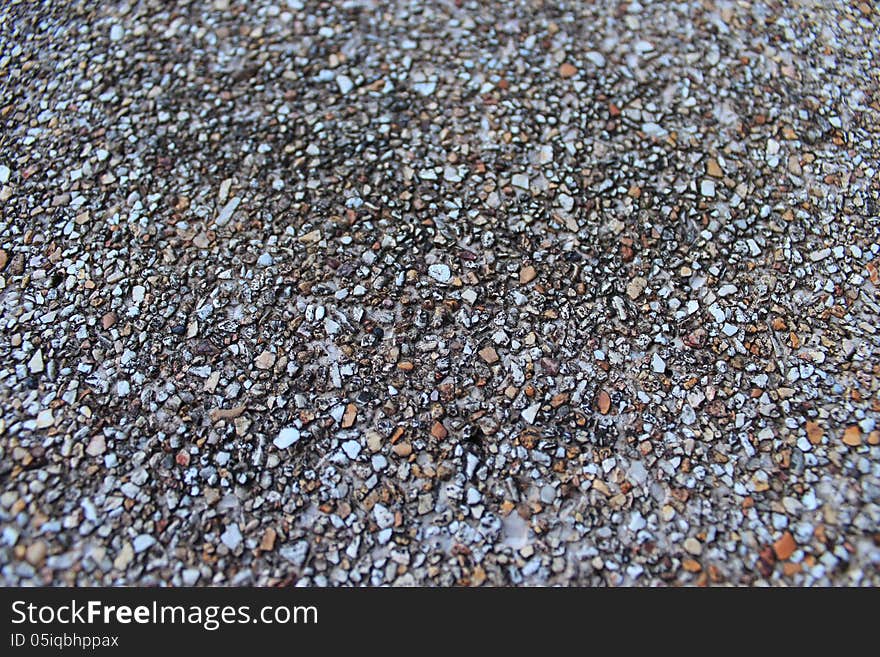 Small stones on the table. Stones hold a table and chairs.A beautiful and delicate.