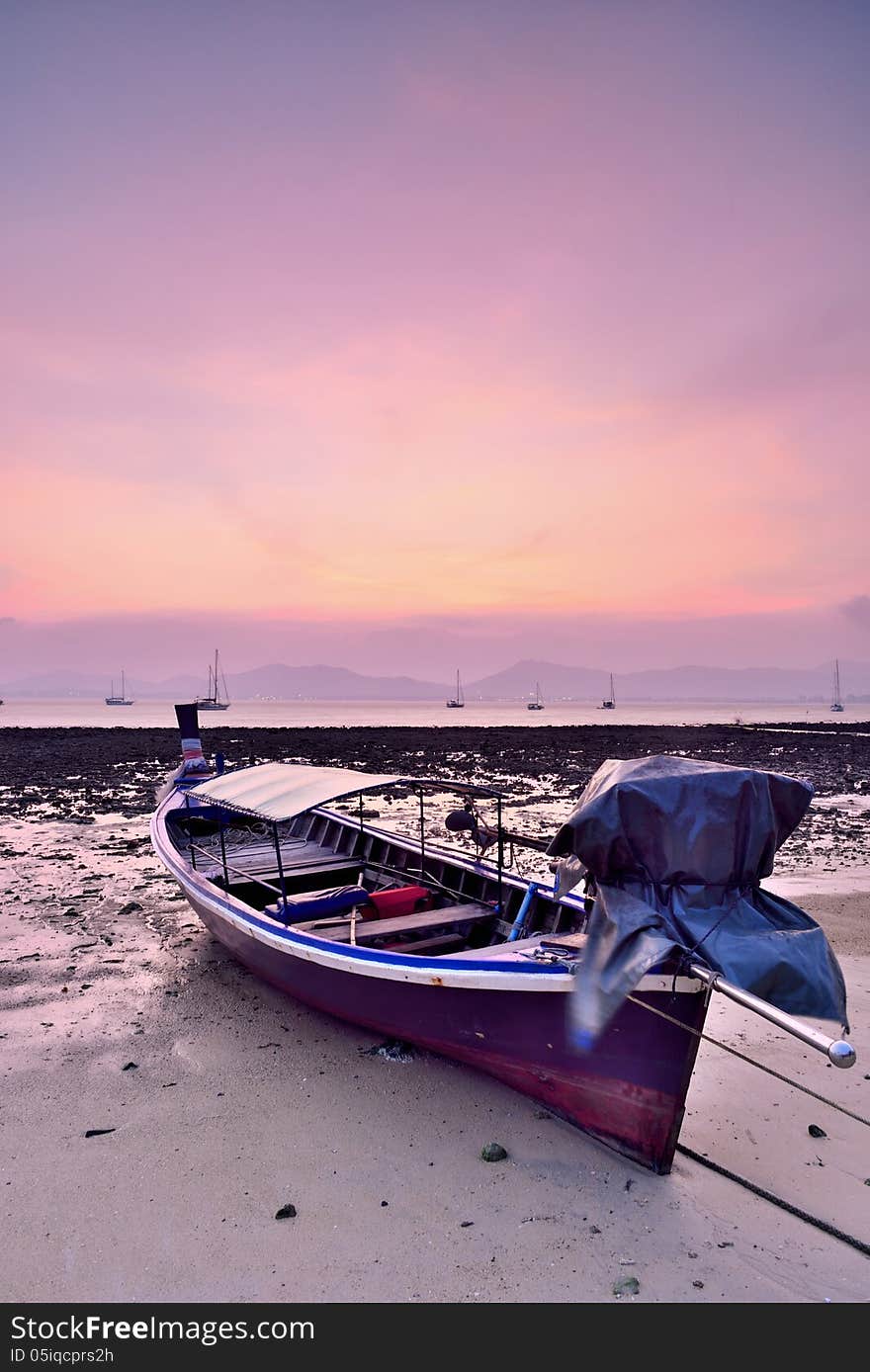 Traditional Thai Longtail Boat at Sunset