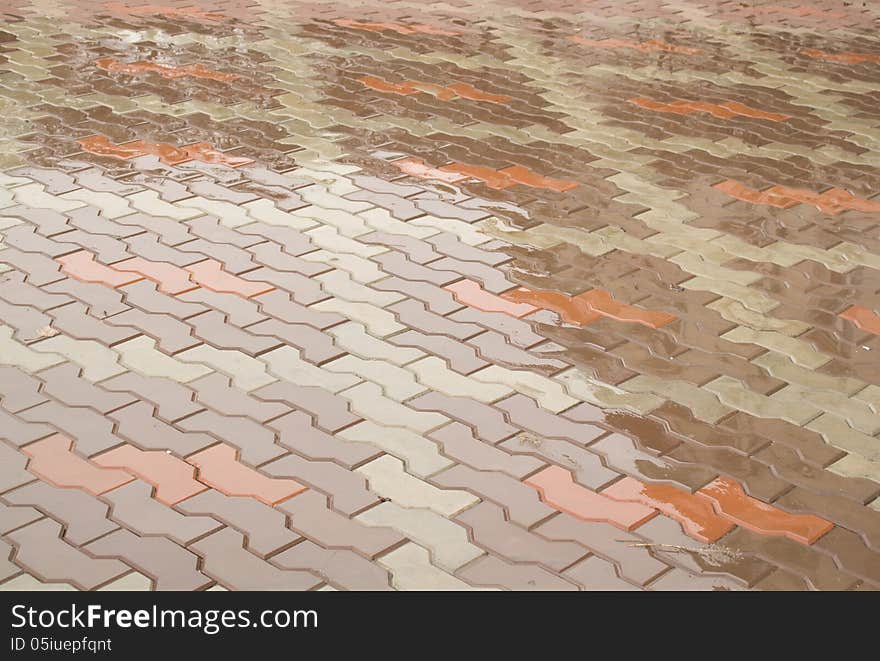 Brown paving slabs under water. Brown paving slabs under water