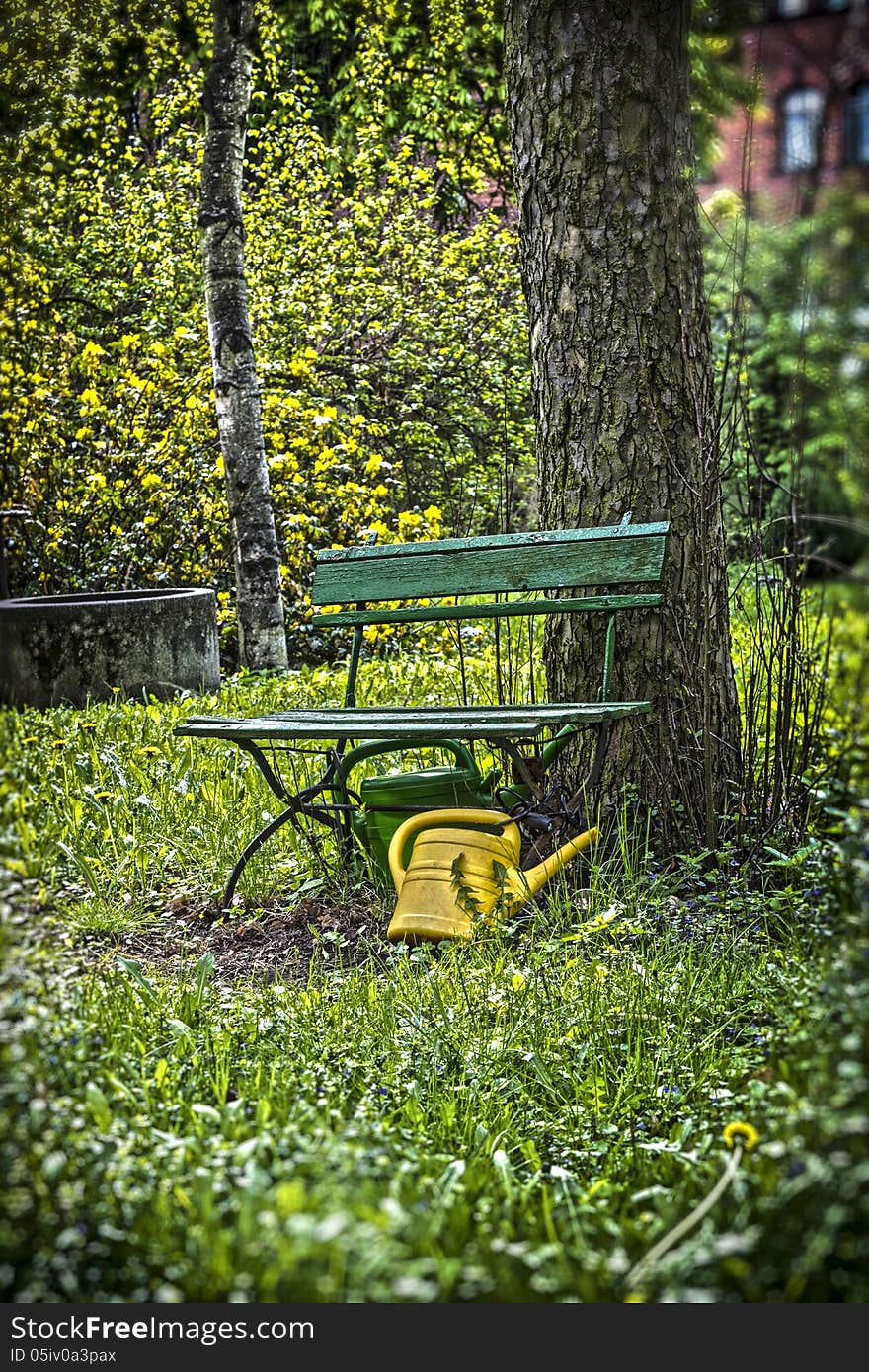 Garden Bench With Yellow Ewer