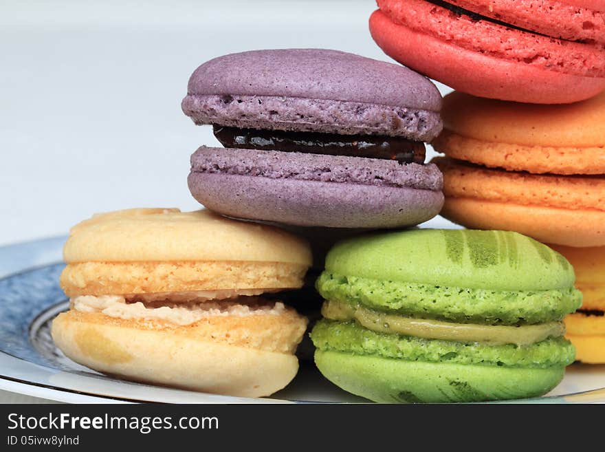 Assorted macarons piling on a plate