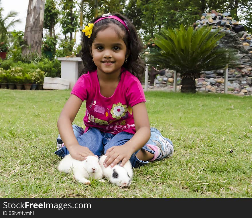 Girl Playing With Rabbits.