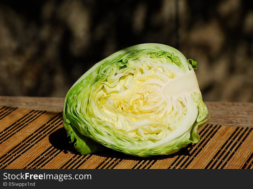 Half of the cabbage on the table. Half of the cabbage on the table