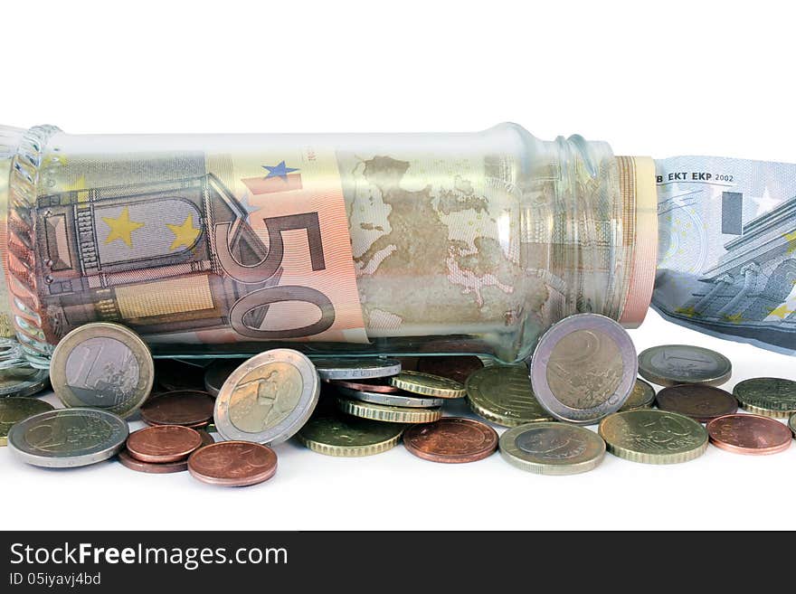 Close up view of money jar full of Euro bank notes and coins. Close up view of money jar full of Euro bank notes and coins.