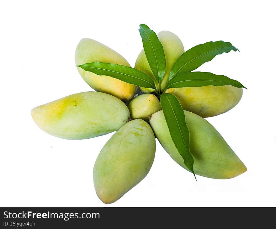 Mangoes in star shape with leaves on top.