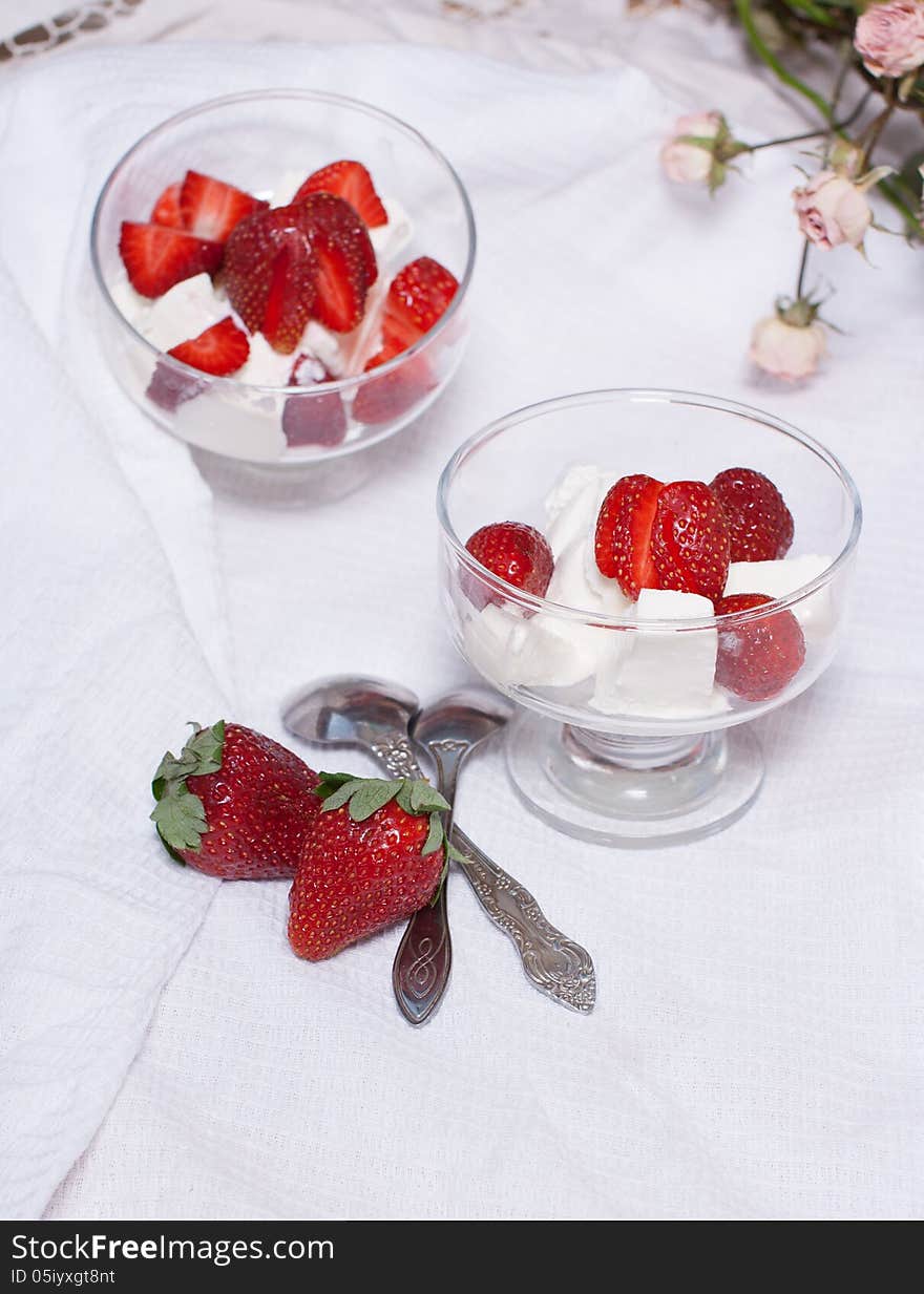 Strawberry dessert with ice cream in a sundae dish