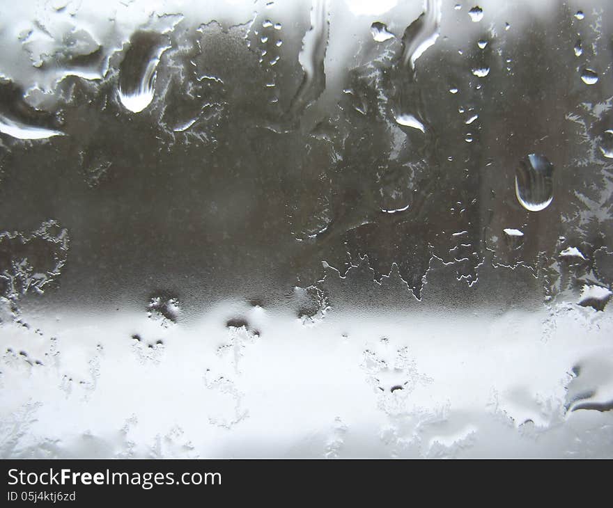 Window Glass And Rain Drops