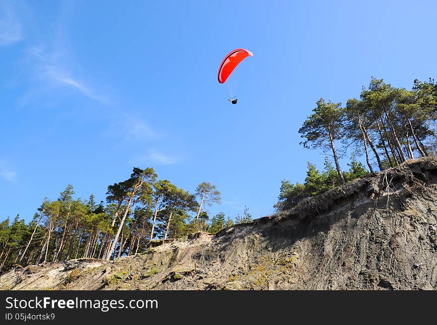 Paraplane flight. Paraplane flight over forest