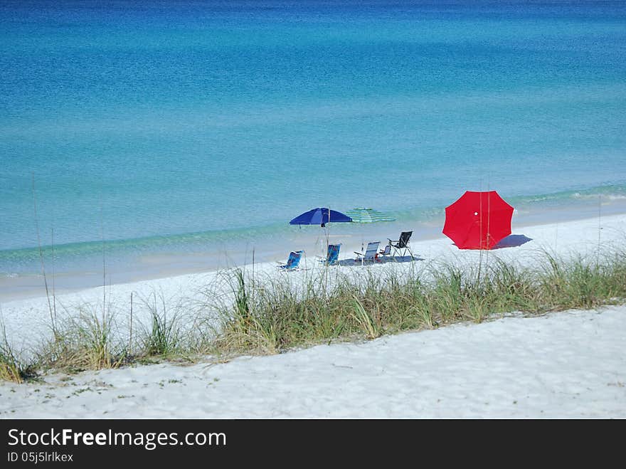 Beach Chairs and Umbrella on the Sand