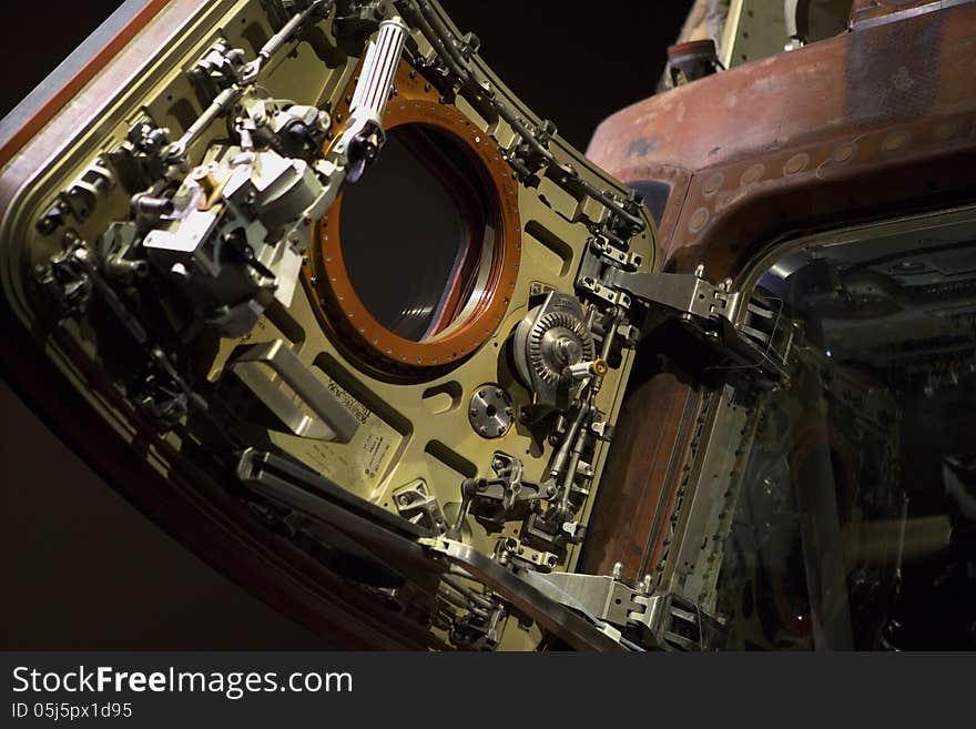 Detail image of the hatch of the Apollo 8 Command Module on display at the Kennedy Space Center. Image shows detail of the hatch door and some of the interior of the capsule. Detail image of the hatch of the Apollo 8 Command Module on display at the Kennedy Space Center. Image shows detail of the hatch door and some of the interior of the capsule.