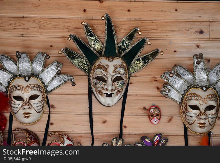 three masks on the wooden wall