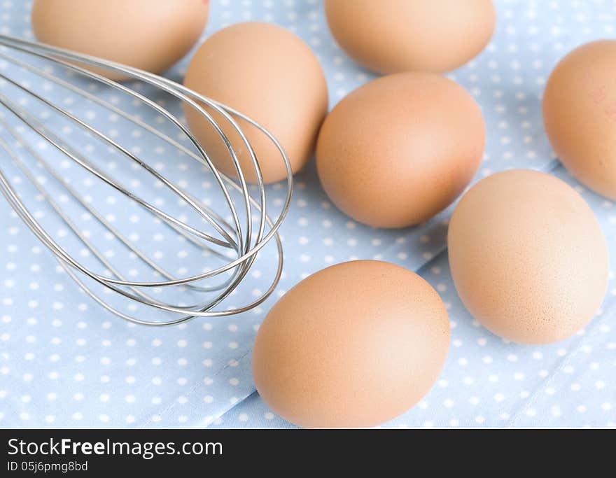 Brown Eggs and Wire Whisk. Brown Eggs and Wire Whisk