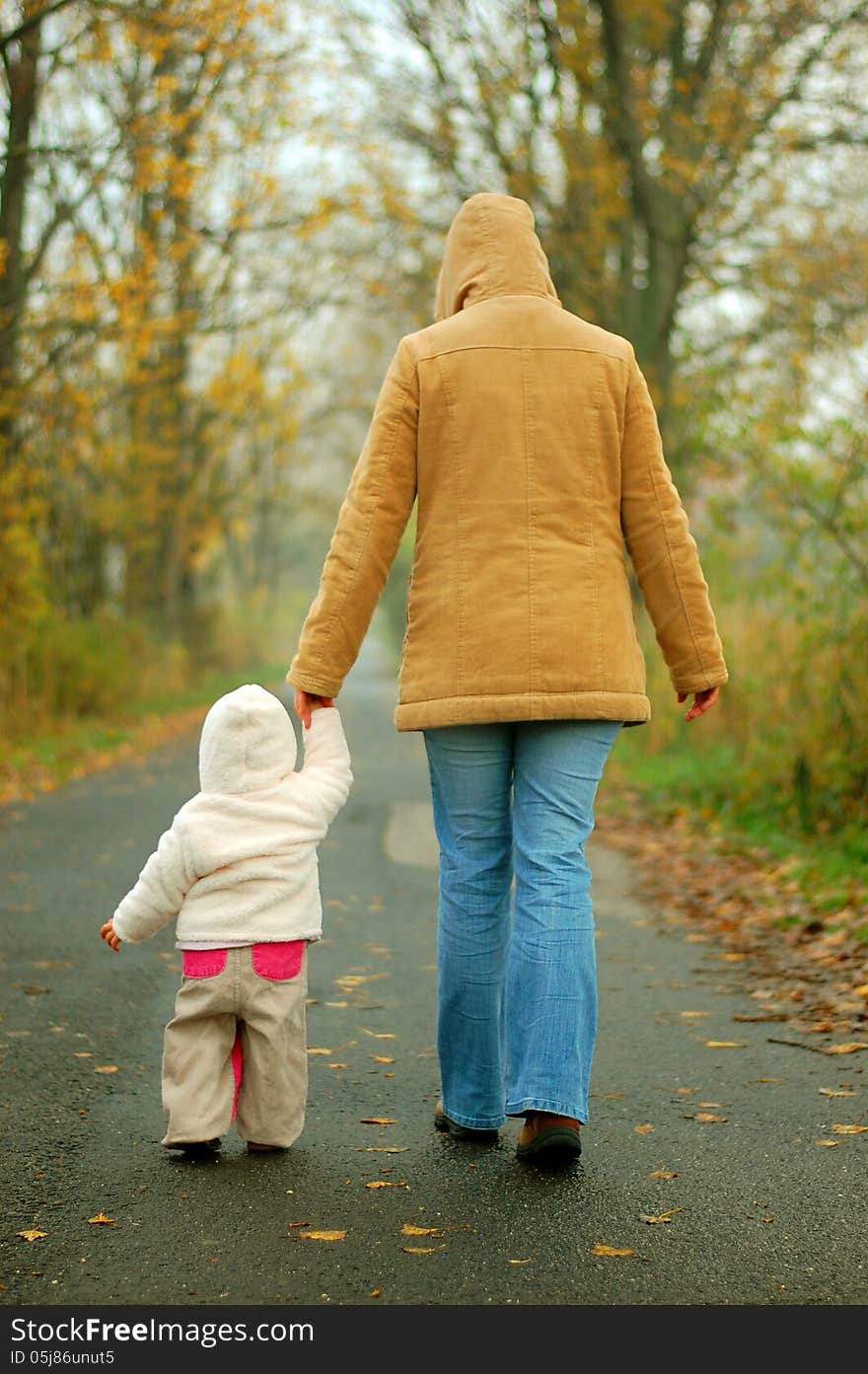 Mother and baby taking and afternoon walk in the park