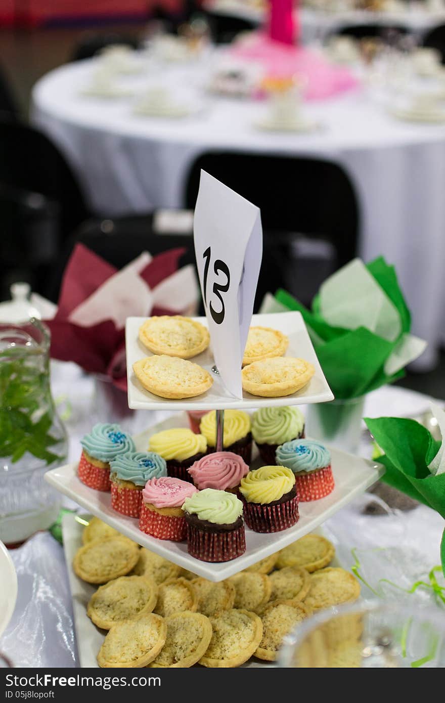 Cupcake pyramid with tarts and napkins. Cupcake pyramid with tarts and napkins