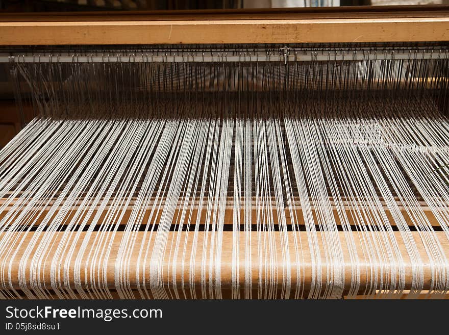 Hand loom in front view - All strings attached - Textile abstract. Hand loom in front view - All strings attached - Textile abstract