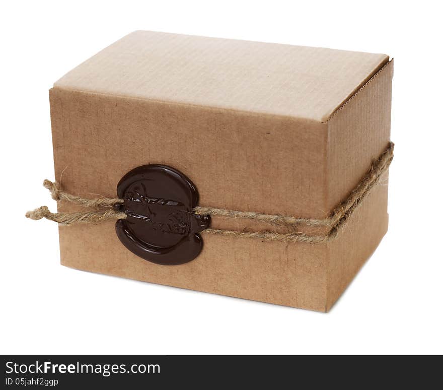 Brown cardboard box with stamp isolated on white