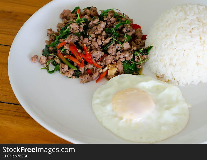 Rice with stir fried hot and spicy pork with basil. Rice with stir fried hot and spicy pork with basil