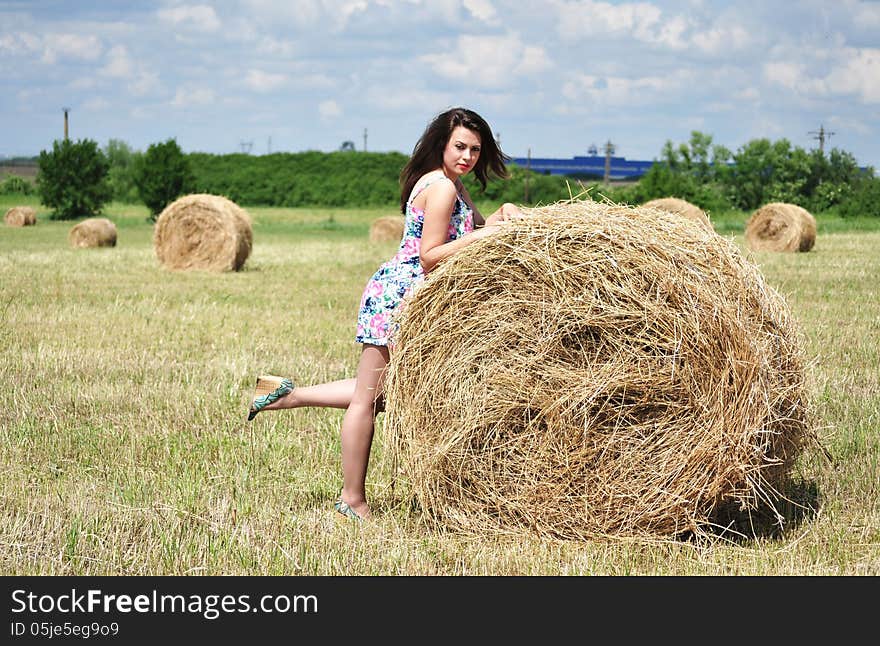 Beautiful Girl Near Haystacks