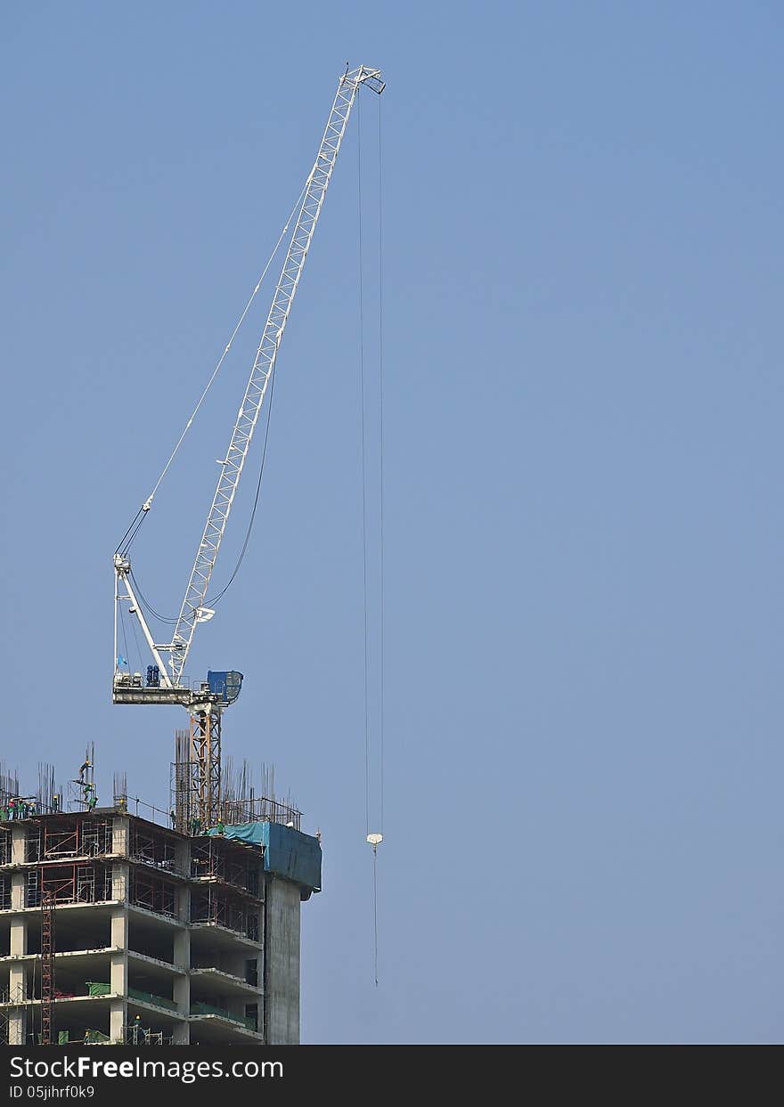 Cranes work for lifting tool at top of high building. Cranes work for lifting tool at top of high building