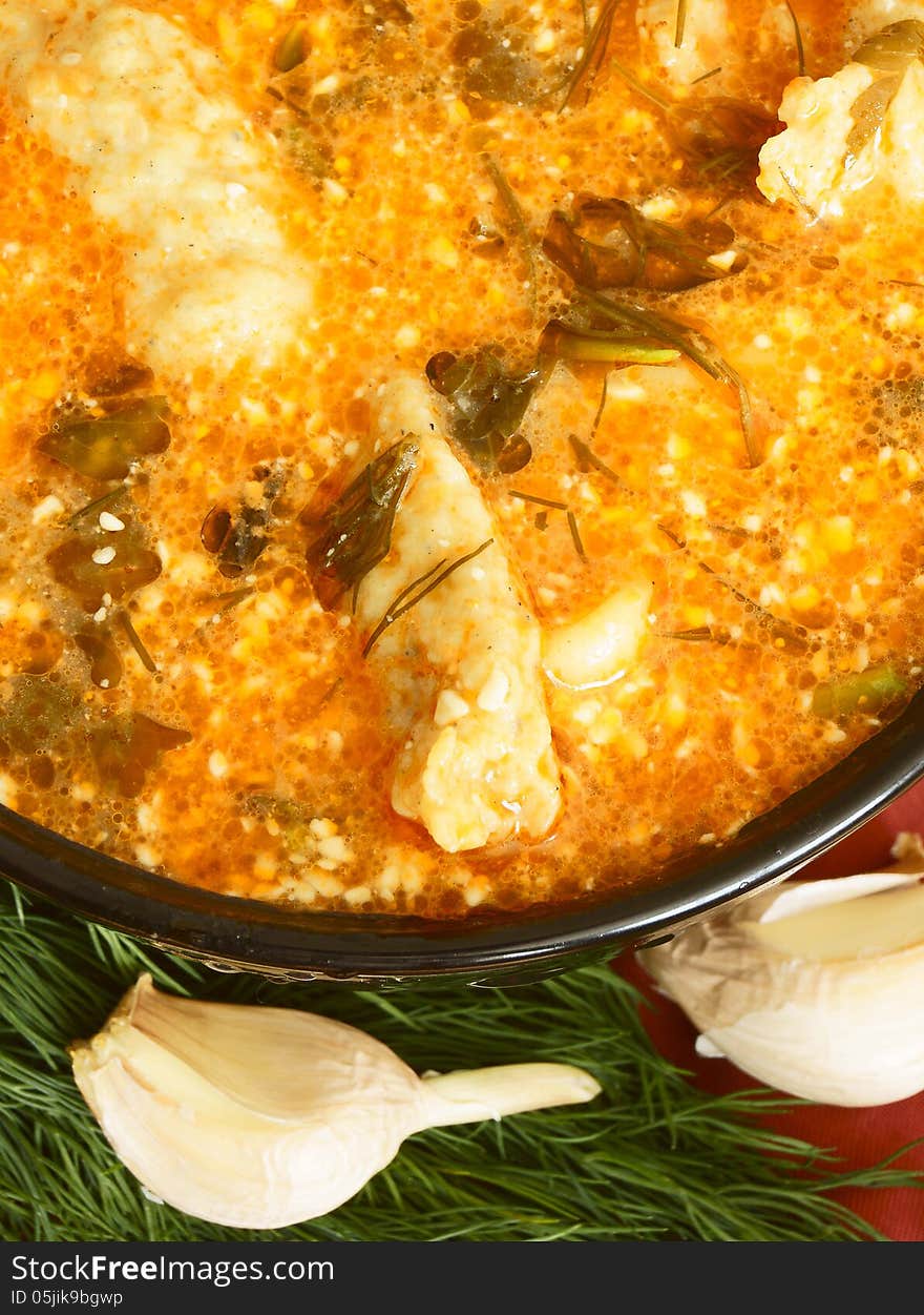 Soup with dumplings and noodles.